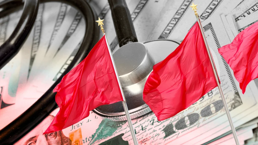 stethoscope and money with red flags