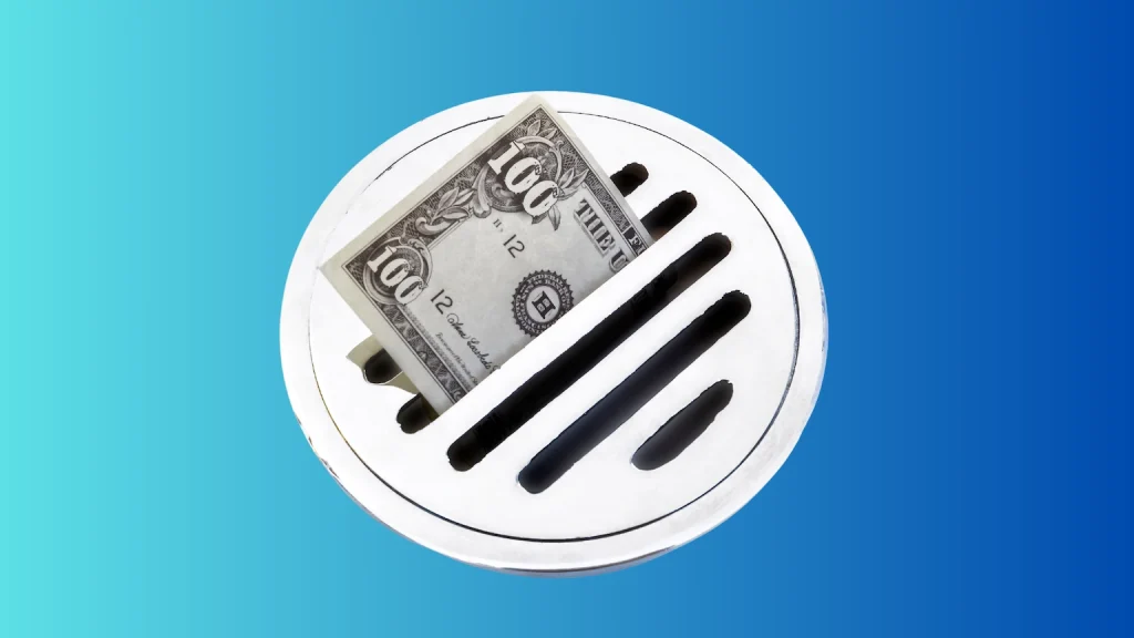 a 100 dollar bill going down the drain