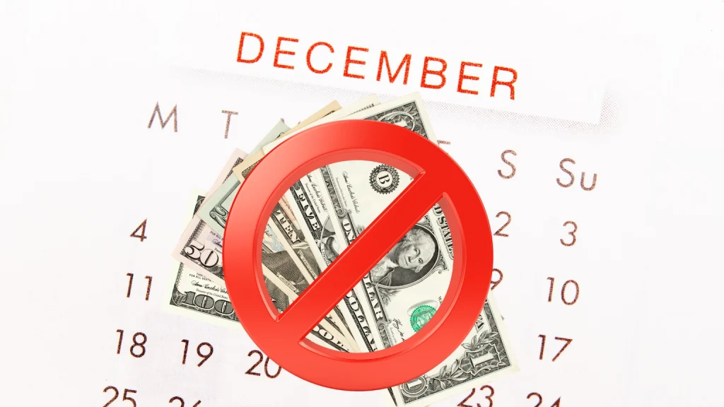a december calendar with money and a red no sign
